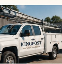 A white work truck with Kingpost lettering on the door